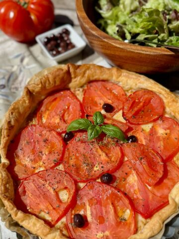 baked tomato tart with french niçoise olives, basil and a green salad